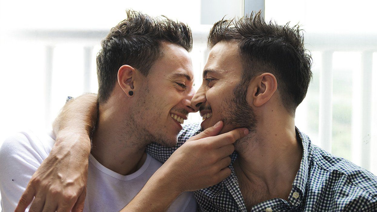 sex toys to use on him: cute gay couple kiss