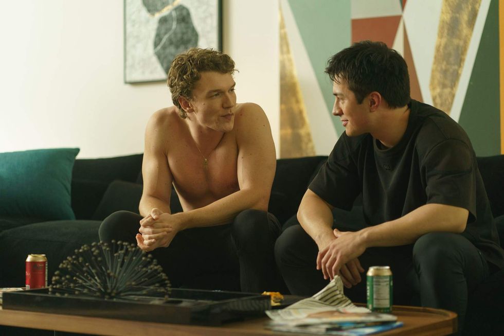 Shane and Ilya sitting on a couch in 'Heated Rivalry.'\u200b