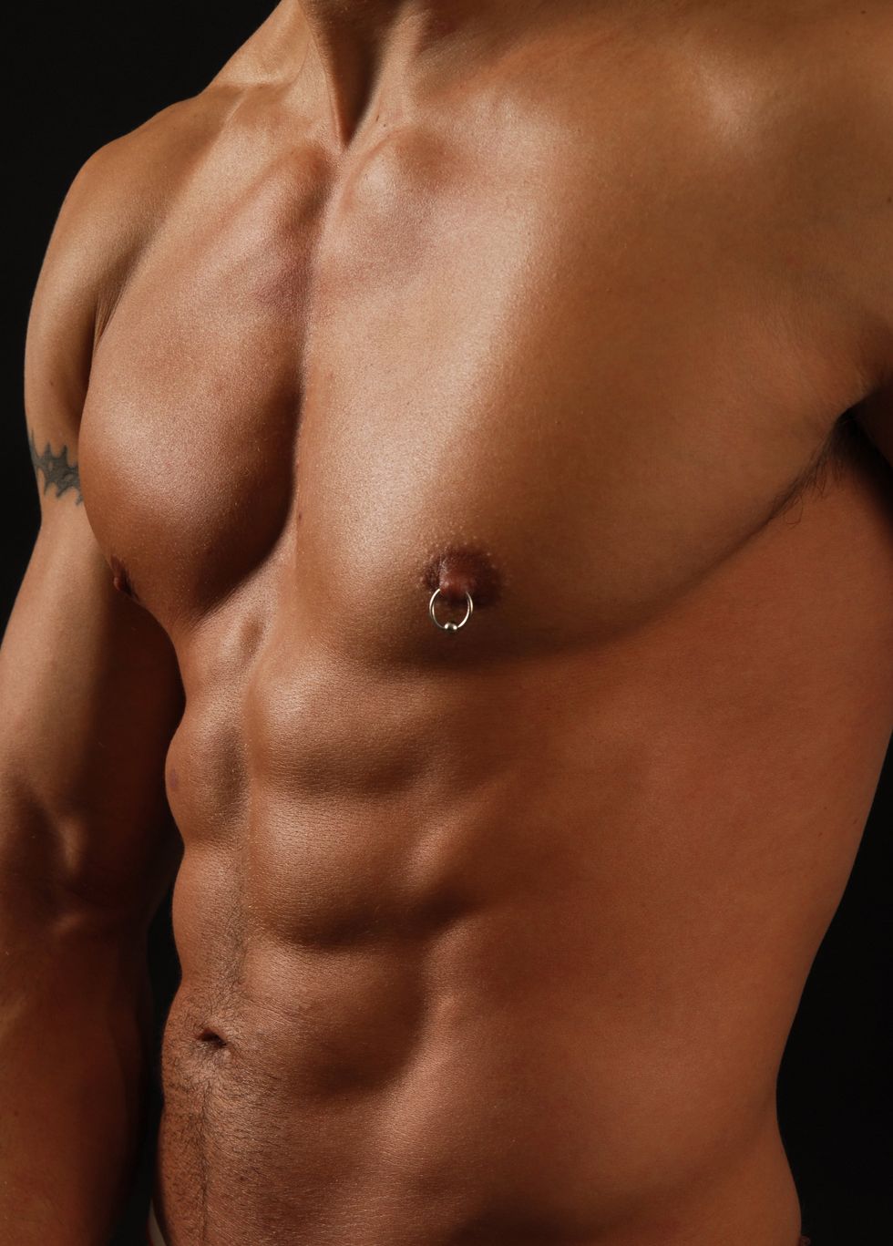 shirtless man with nipple ring