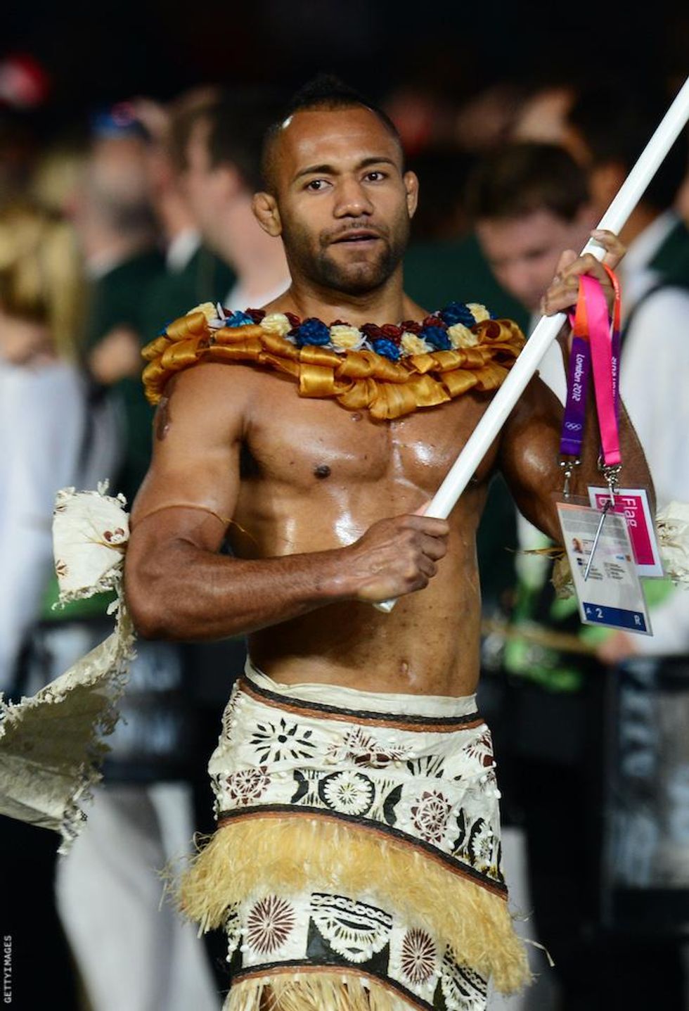 Shirtless Olympic flag bearers