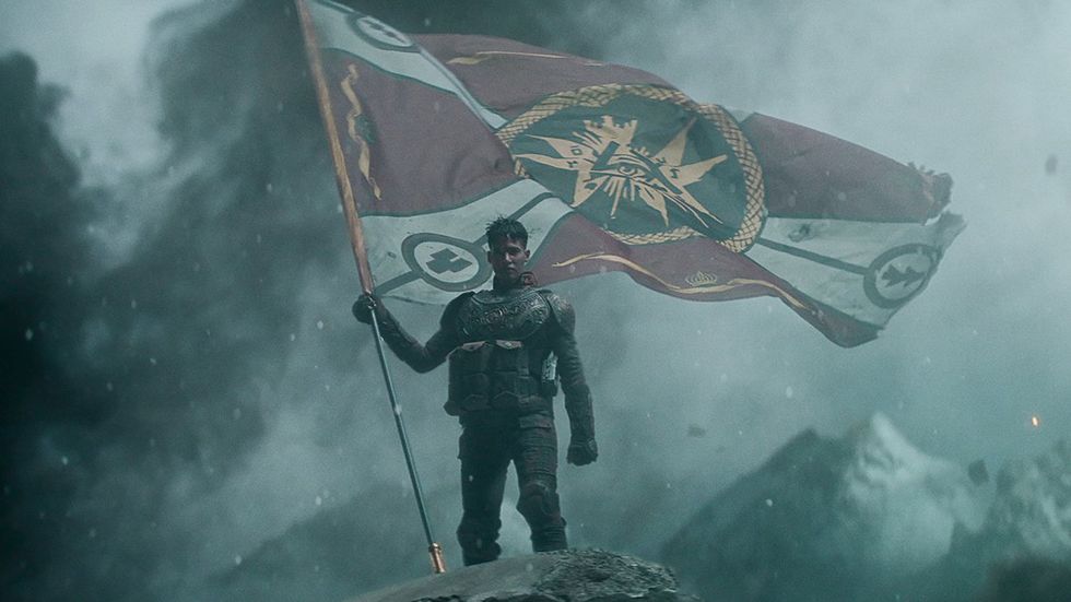 Sofia Boutella holds a flag in Rebel Moon 