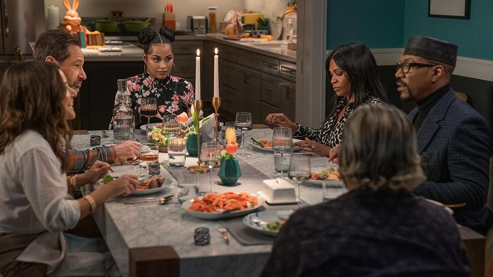 The cast of You People sit around a dinner table talking