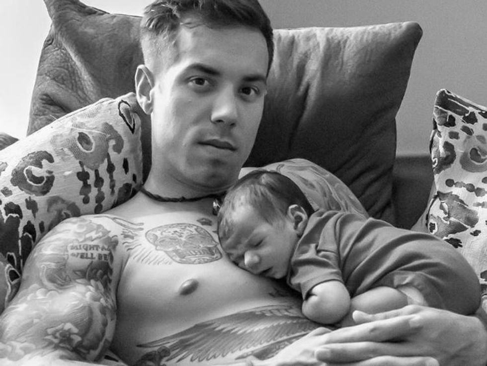 There's just something about a man holding a baby that gets us every. time.
