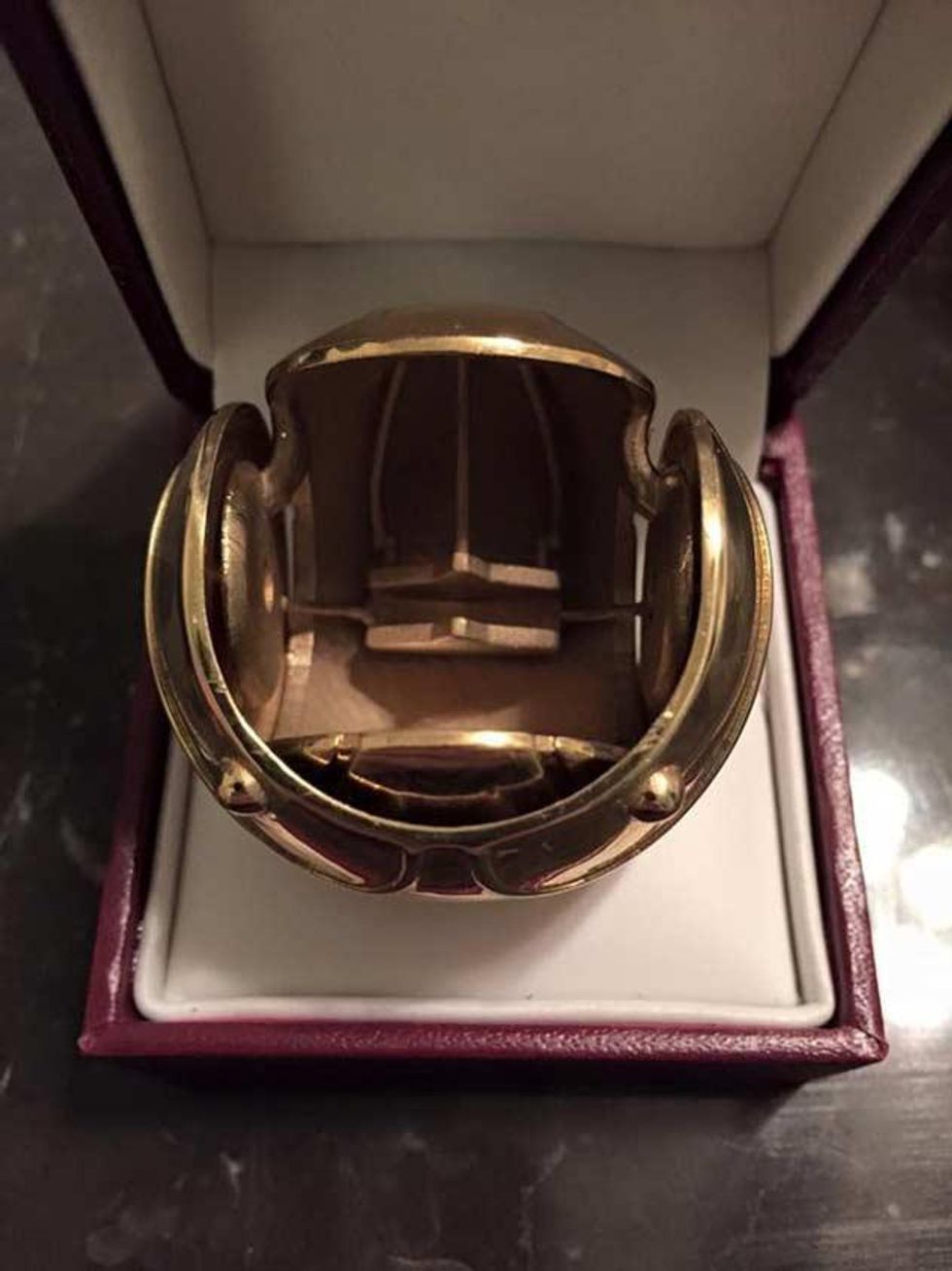 This is a photo of a Golden Snitch ring box. 