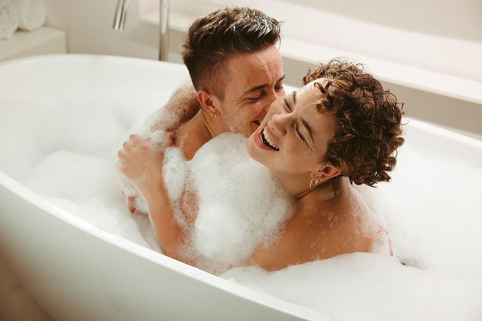 Trans couple in a bubble bath