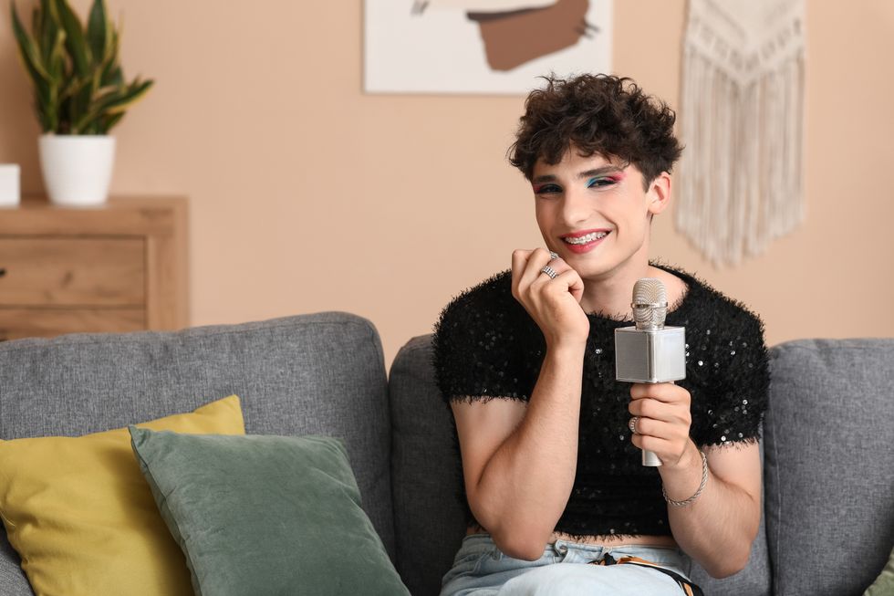Trans person holding a microphone