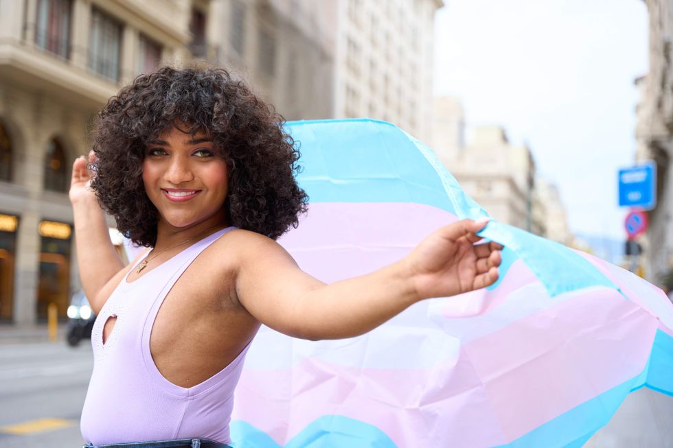 Transgender person with a trans flag