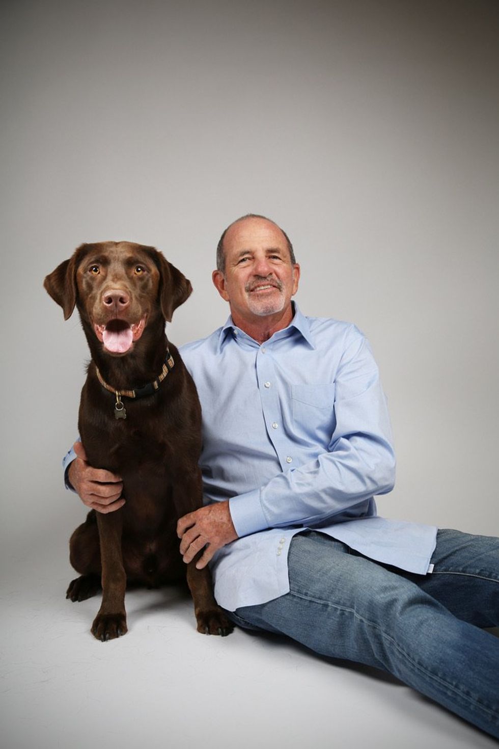 TrueBlue Founder & CEO Doug Gleason with his Chocolate Lab Charlie