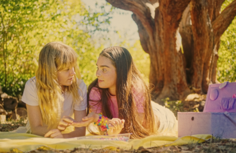 two girls laying together in the grass from My First Summer