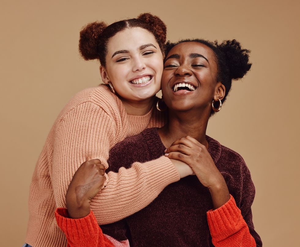 two girls smiling and laughing