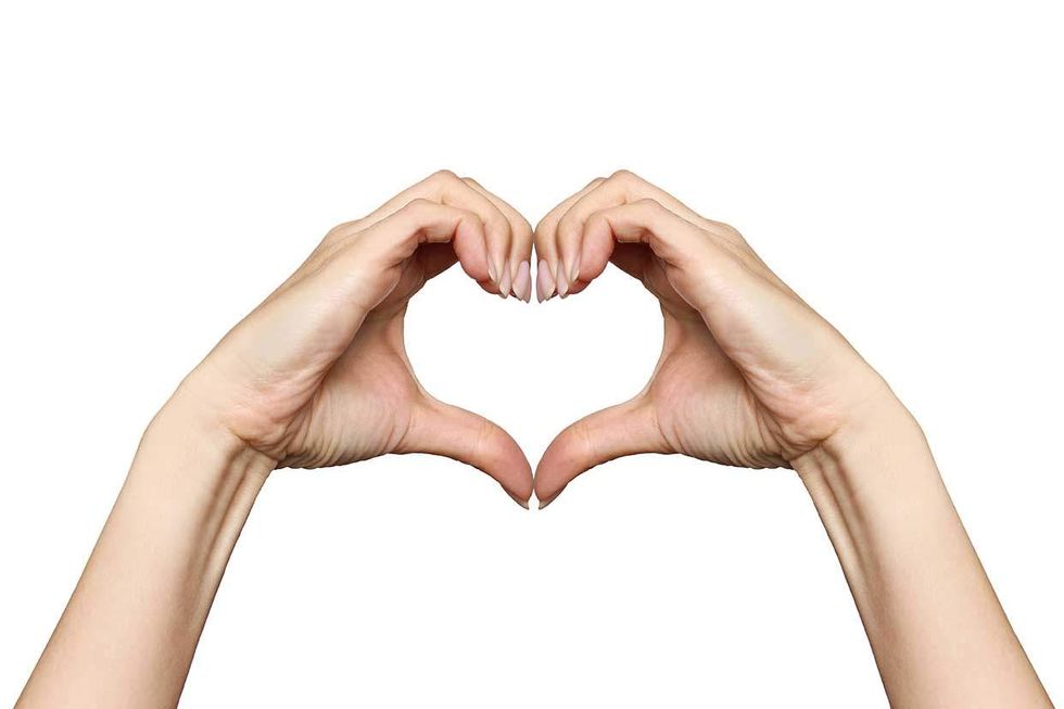 two hands making a heart symbol