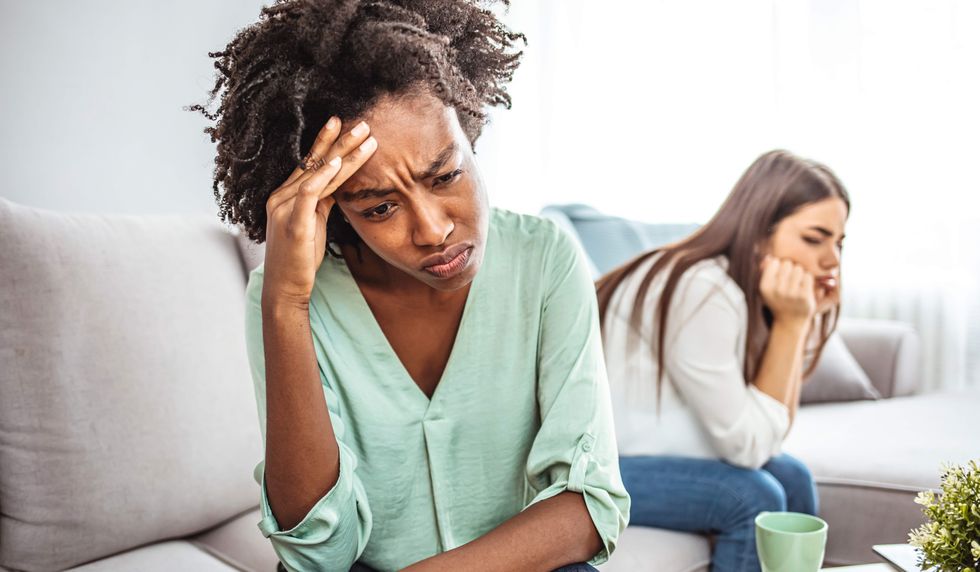 two lesbians turned away from each other