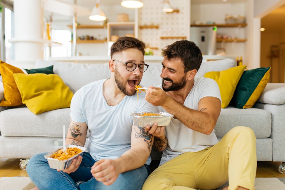 two men eating together