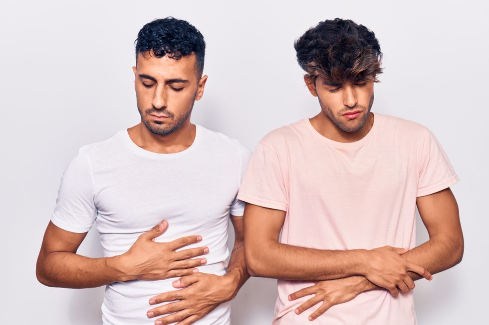 two men experiencing cramps