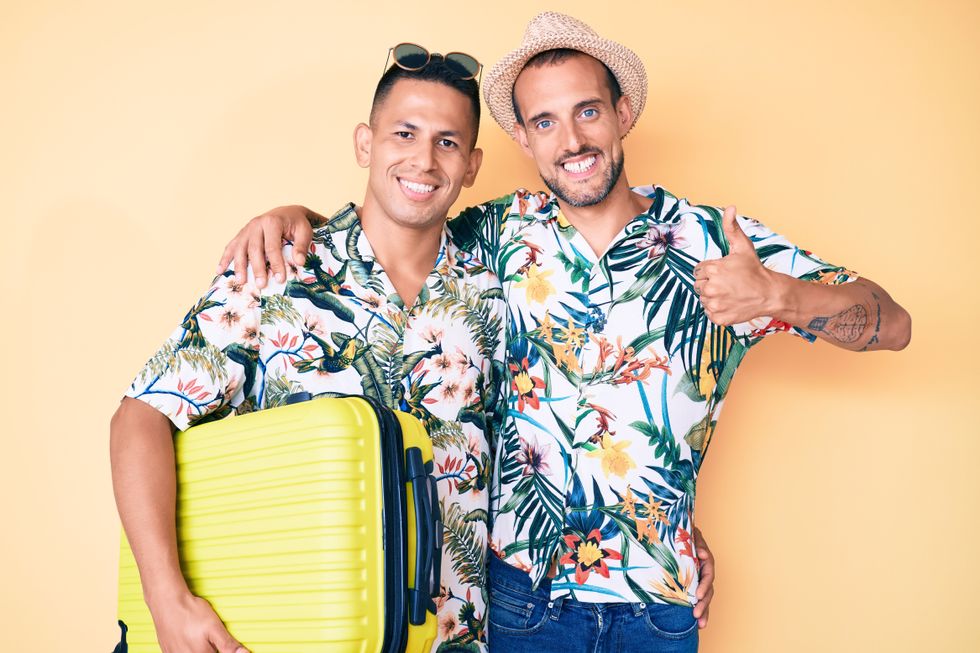 two men in matching hawaii shirts