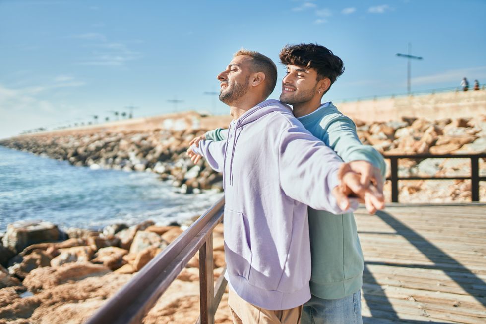two men looking out over the ocean