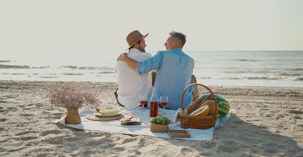 two men on a date at the beach
