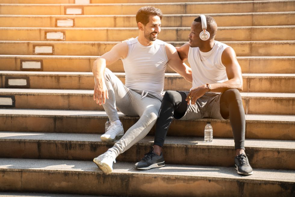 two men talking on stairs