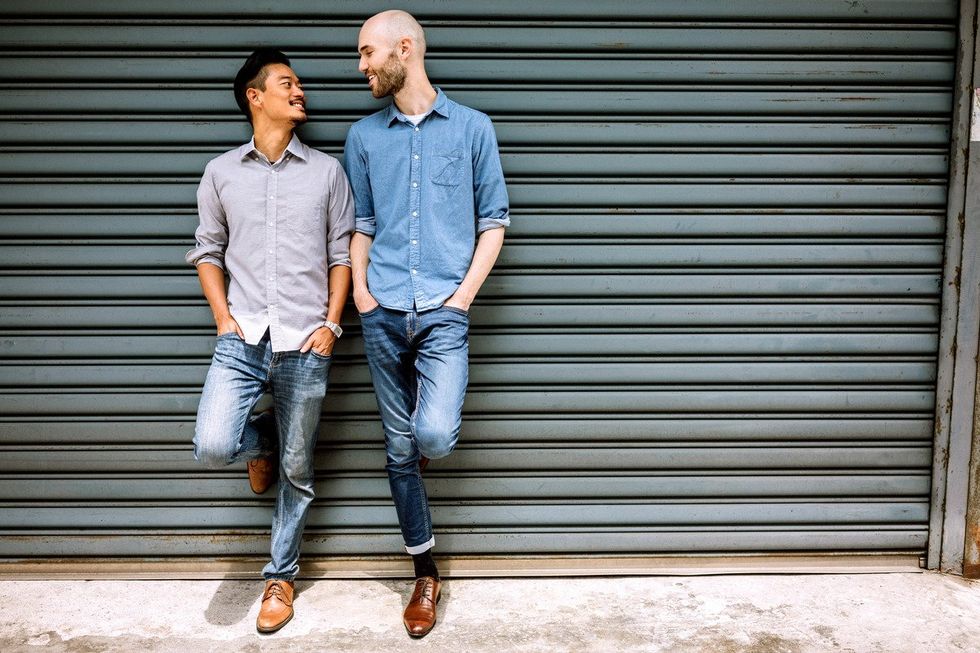 Two same-sex partners flirting on the street
