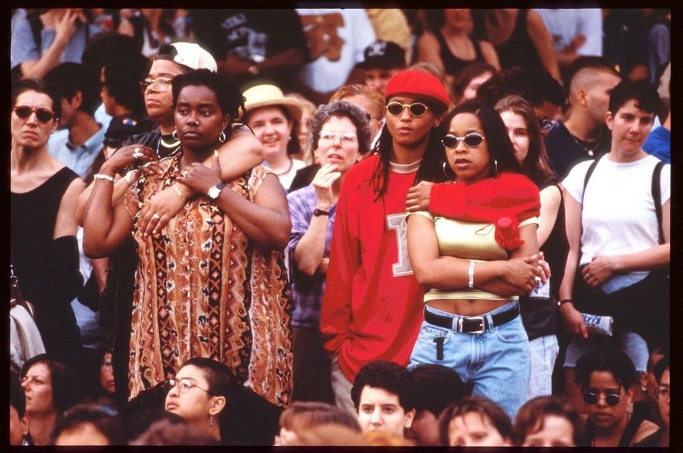 Two unidentified couples stand at the Third Annual Lesbian Pride Parade June 24, 1995 in New York City.