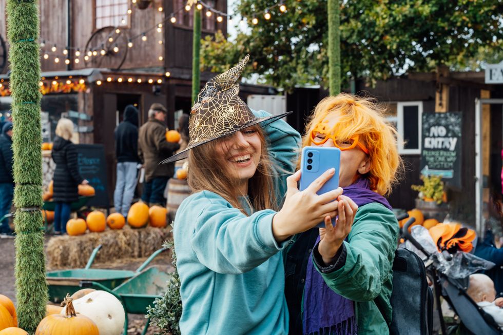 Two women at a pumpkin patch