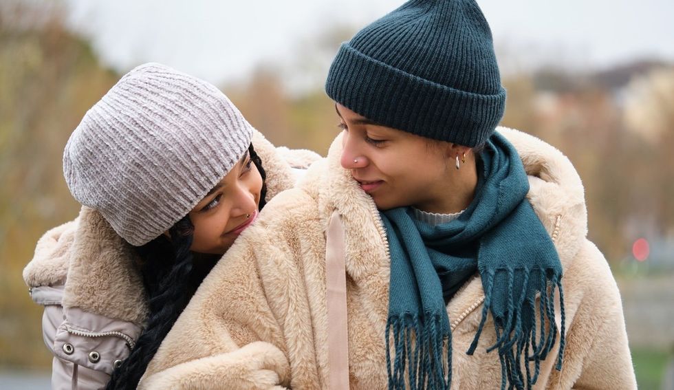 Two women bundled up