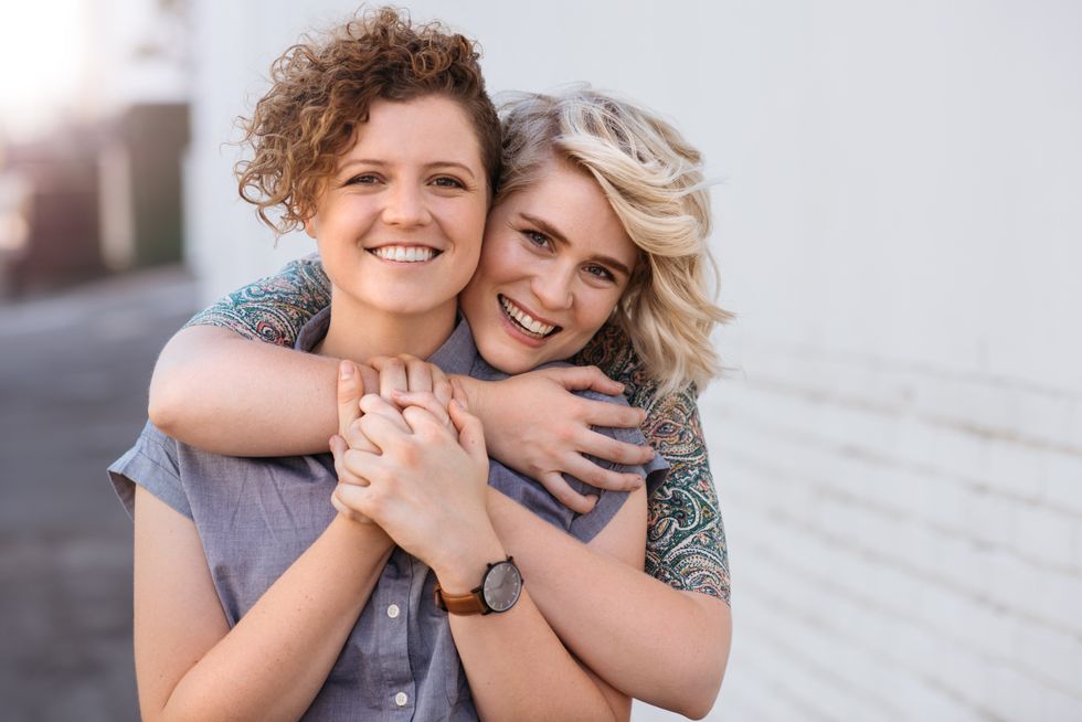 two women hugging and smiling