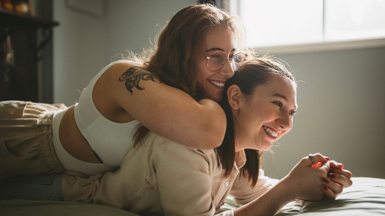 Two women lying on top of each other