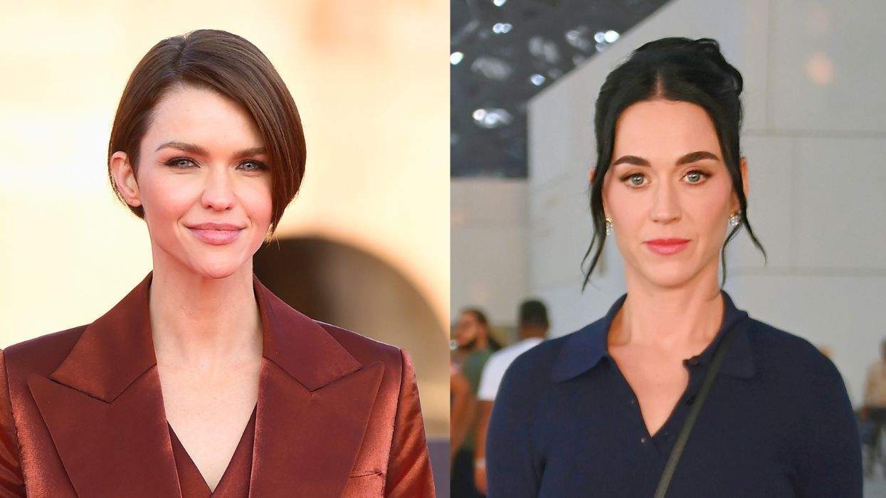 Two women side by side, one in a red suit, the other in a dark top.