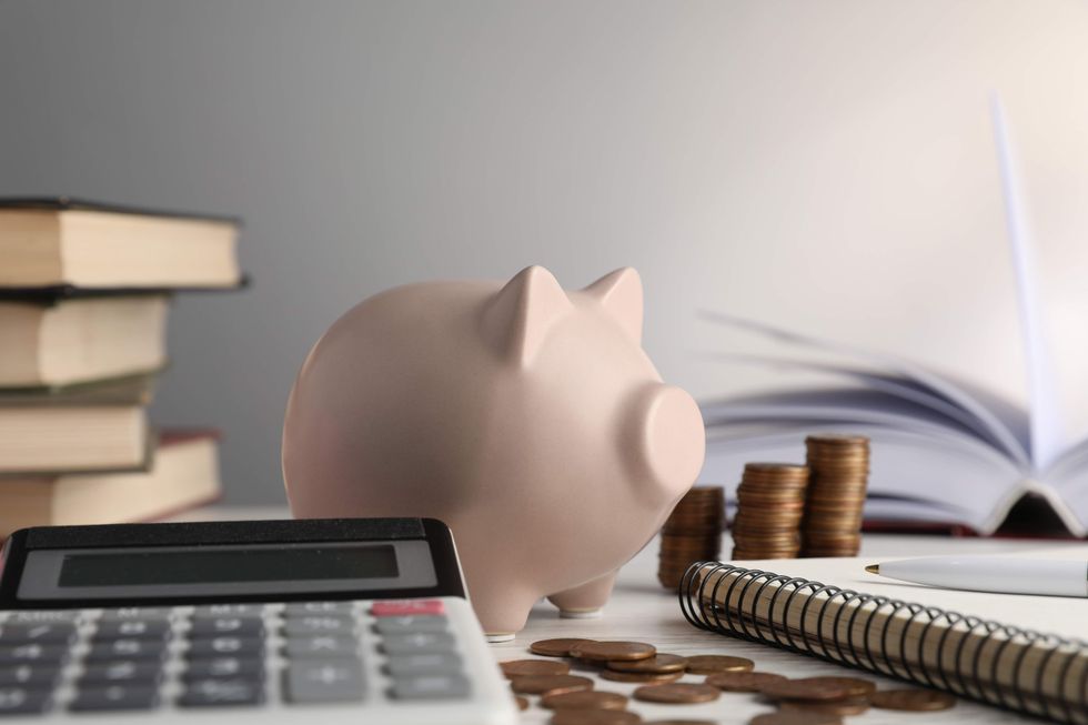 \u200bPiggy bank and calculator.