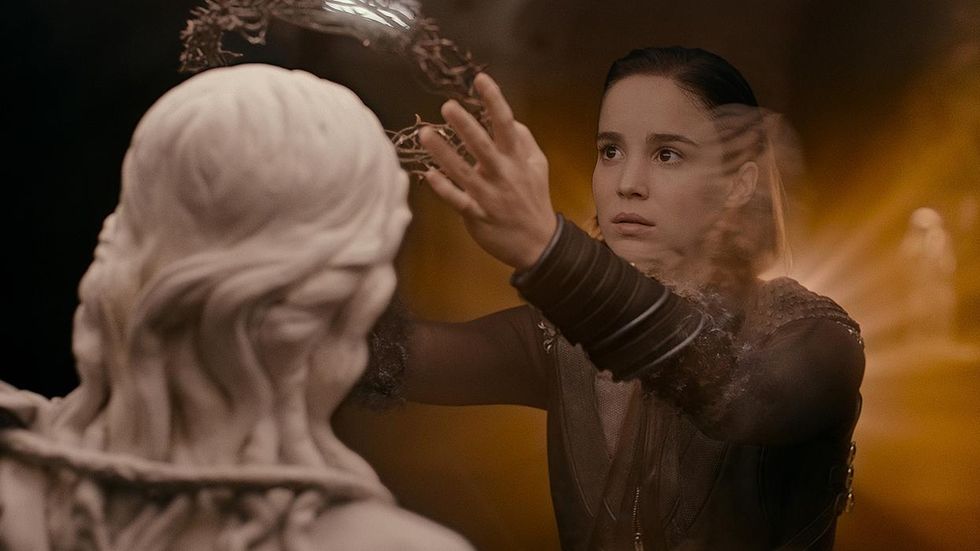Warrior Nun screenshot Ava Silva (Alba Baptista) lifts a crown off a statue