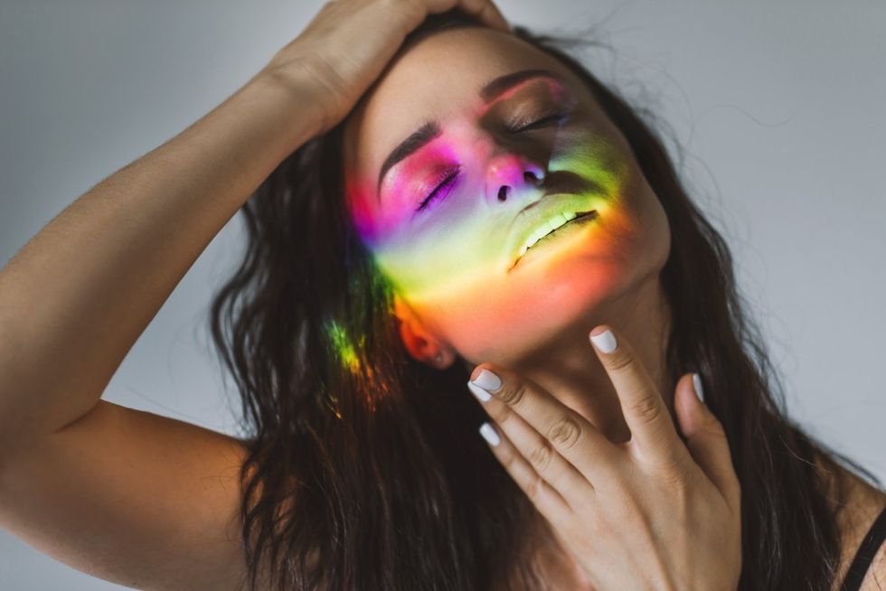 woman a rainbow on her face