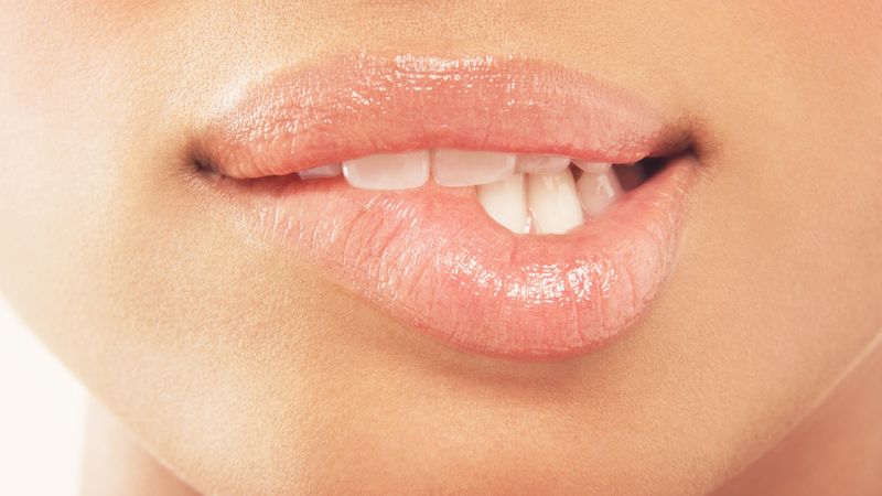 Woman biting her lip