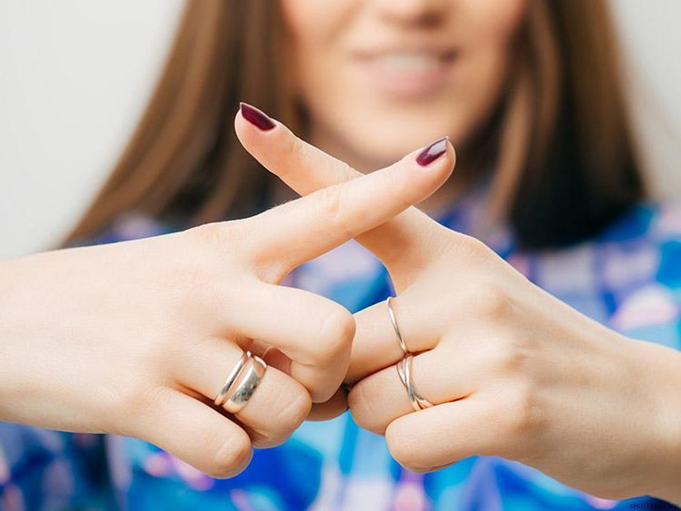 woman crossing fingers