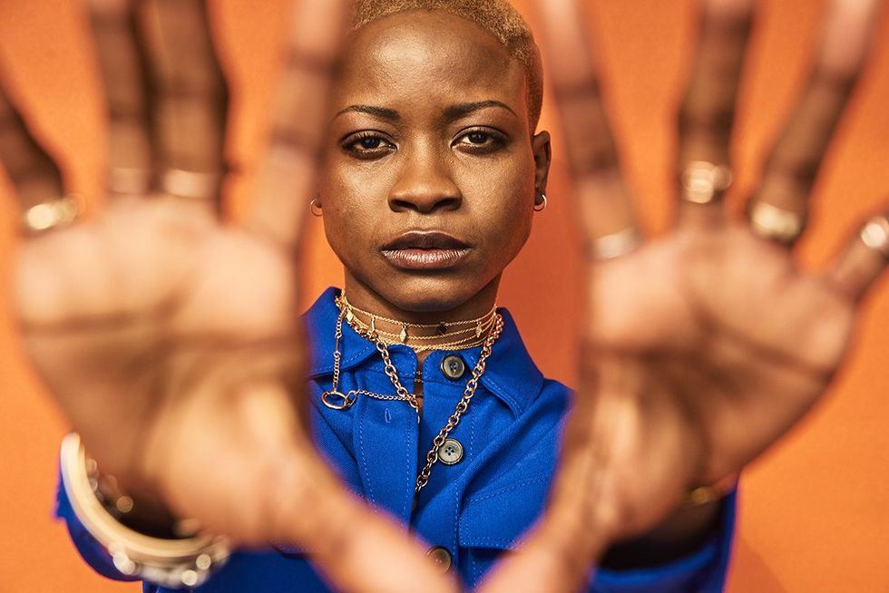 woman holding up hands