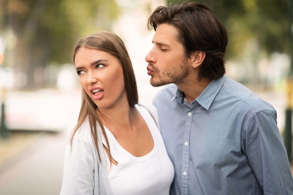 Woman turning away from a man in disgust