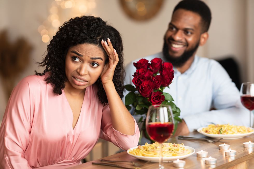 Woman turning away from a man on a bad date