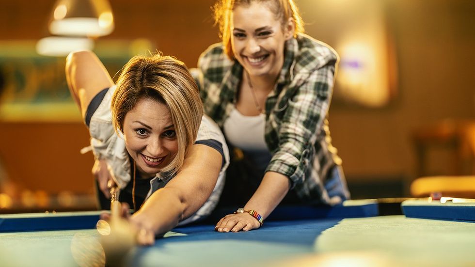 women playing pool