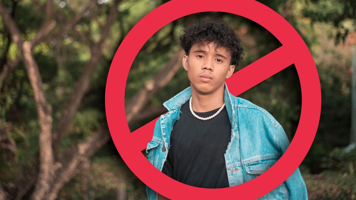 Young man with a red no symbol